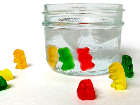 Four gummy bears melting