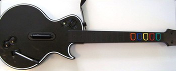 A plastic guitar used to played the game Guitar Hero on the Xbox 360
