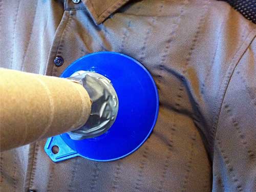 A DIY stethoscope made from a funnel and cardboard tube