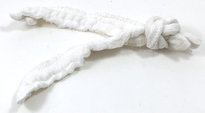 Two cotton strips tied together at one end