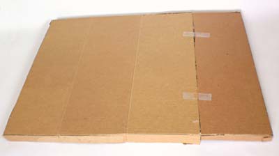 A cardboard lid is created from a sheet of cardboard and tape