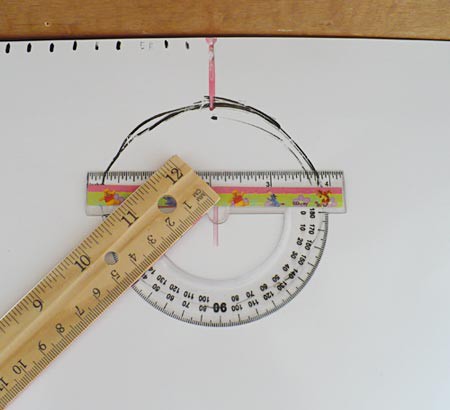 A protractor is placed at the center of a circle and lines are drawn at 30, 60 and 90 degree angles