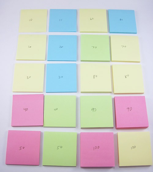 Twenty paper pads arranged in pairs of two based on a matching number of pages per pad