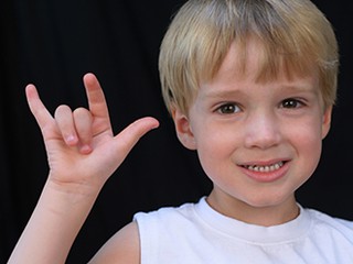 Child doing sign language