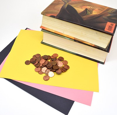 Paper, pennies and two large textbooks