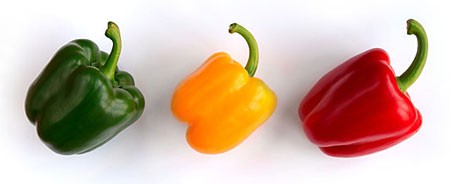 A green, yellow and red bell pepper