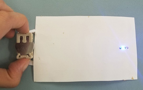 LED lighting up with by connecting battery to the circuit. 