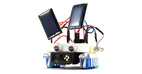 A small bristlebot has two small solar panels mounted above its body
