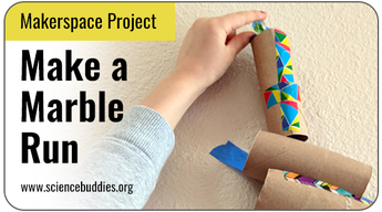 Makerspace STEM: student dropping marble into a marble run made of toilet paper tubes